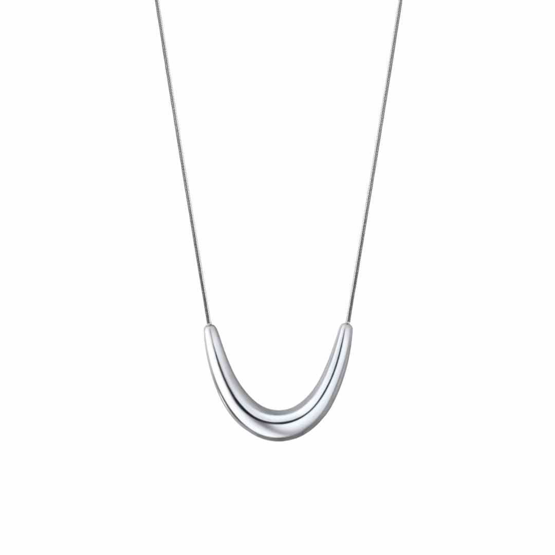 A silver-colored pendant necklace with a bold pendant on a dainty snake chain.