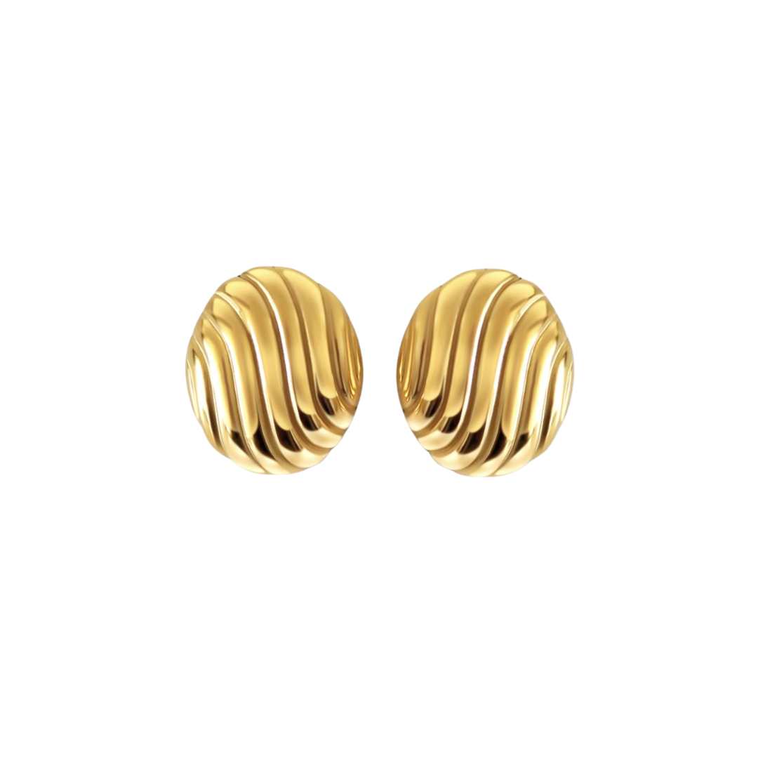 A pair of gold oval statement earrings with wave texture on a white background.