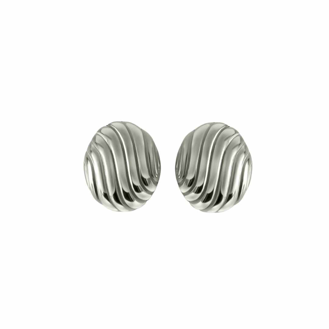 A pair of silver oval statement earrings with a wave texture on a white background.