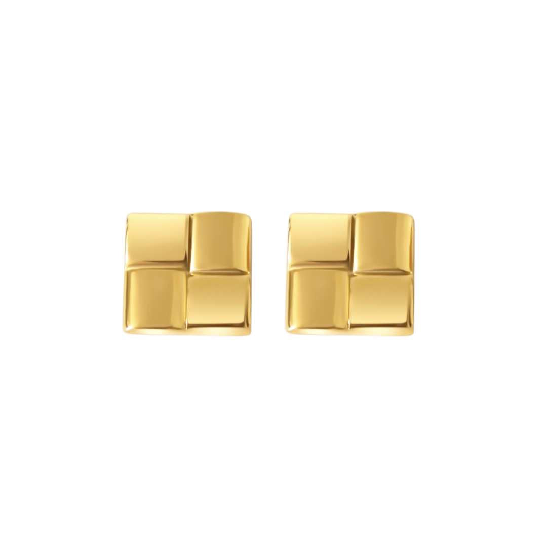 A pair of gold square statement earrings on a white background.