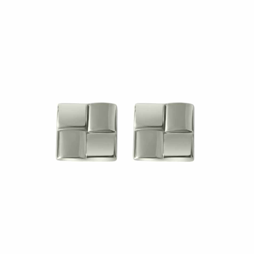 A pair of silver square statement earrings on a white background.