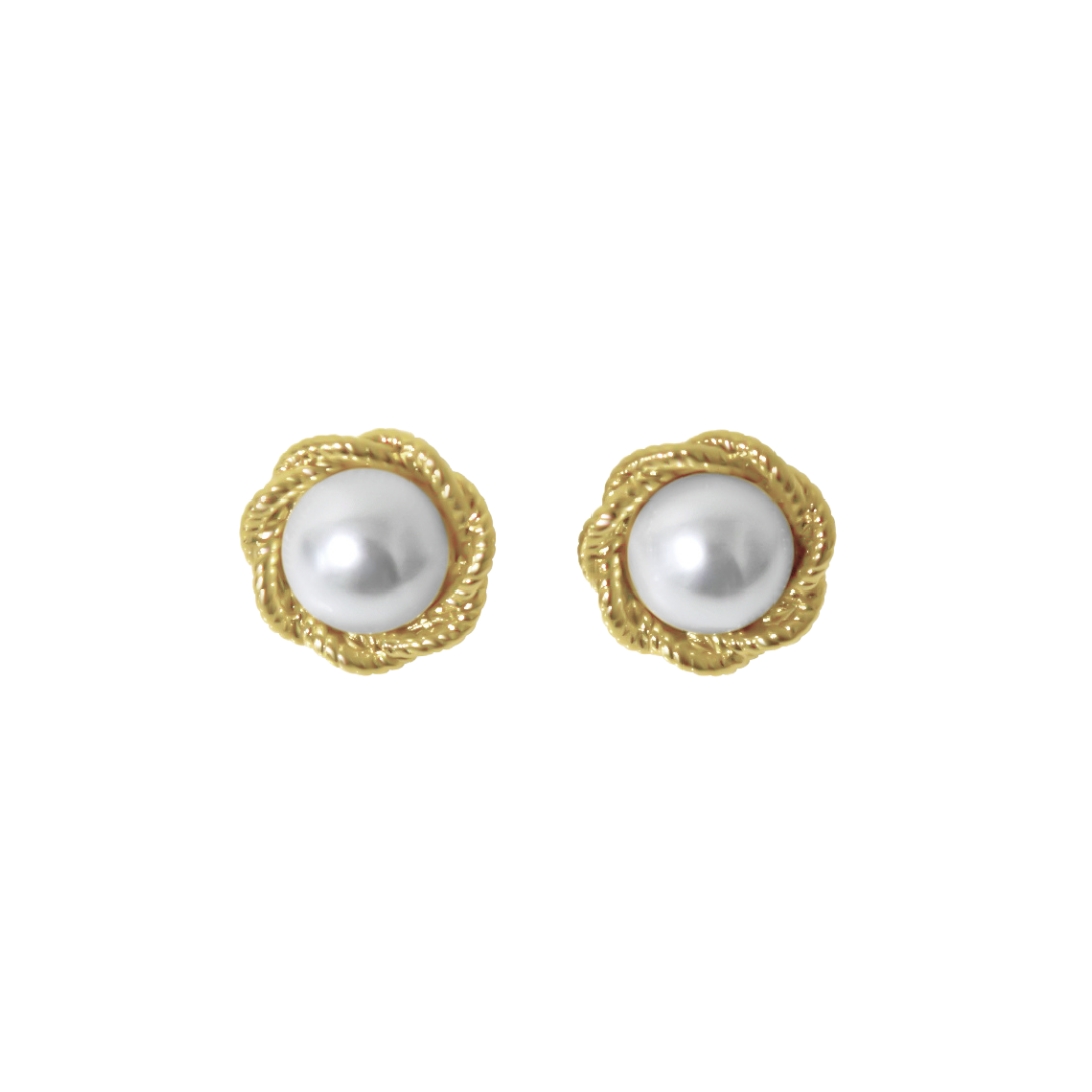 Pair of pearl earrings with gold surround on a white background